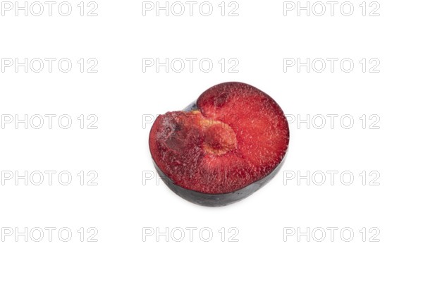Purple Plum Cut in half isolated on white background. Side view, copy space. healthy food,