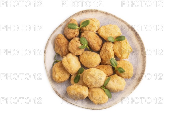 Fried crispy Chicken Nuggets with ketchup, microgreen isolated on white background. top view, flat