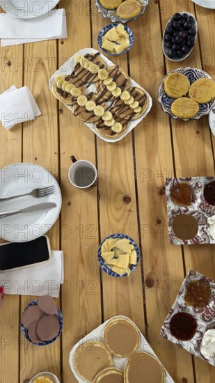 Moroccan breakfast spread with a variety of sweet and savory dishes. Including msemmen. Baghrir