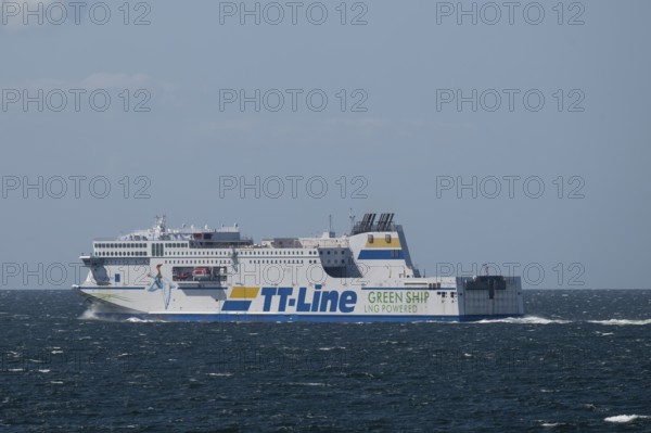 LNG-powered TT-Line ferry travelling across a gently moving blue sea, near Warnemünde, Rostock,