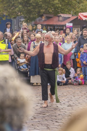An experienced fire artist shows his art to a fascinated audience, Feuernacht, Sindelfingen,