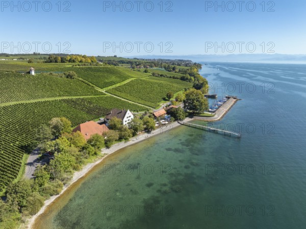 Aerial view of the marina and jetty at the historic Rebgut Haltnau with catering business, outdoor