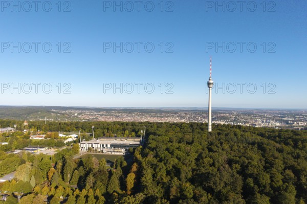 Stuttgart television tower stands above a forest with a sweeping city view in the background, Gazi
