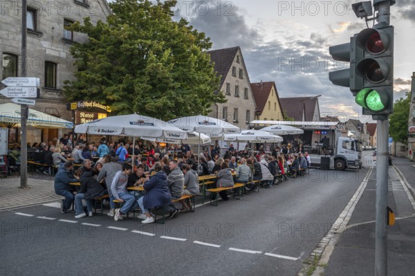 Residents celebrating Kirchweih in front of an inn on the closed B2, Eschenau, Middle Franconia,