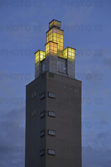Albinmüller Tower built in 1927 by architect Albin Müller, spire with illumination during twilight,