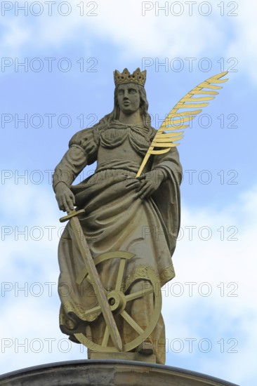 Patron saint Catherine of Alexandria with palm branch at St Catherine's portal built in 1668,