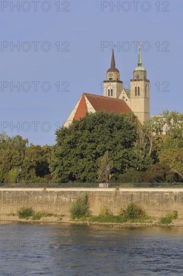 Late Romanesque St John's Church with twin towers on the banks of the Elbe, Magdeburg,