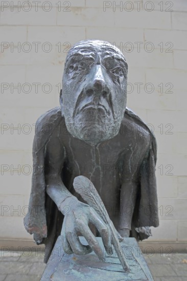 Albertus Magnus by Heinrich Apel 1985, medieval scholar and bishop writing with quill, bronze