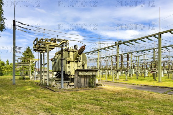 Left large transformer transformer transformer power transformer in substation, right hanging
