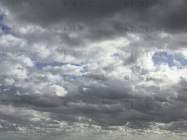 Heavily overcast sky with dark nimbostratus clouds rain clouds at the top and bottom of the