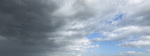 Panorama photo from left cold front clouds of cumulus clouds right in front altocumulus clouds and
