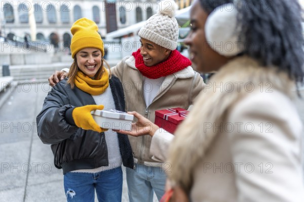 Happy multi ethnic friends joyfully exchanging christmas gifts in a bustling city, celebrating the