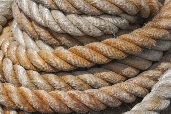 Close-up of several twisted ropes in shades of beige and brown with a clear texture, East Frisia,