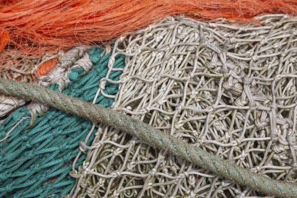 Complex structure of brightly coloured fishing nets and ropes in vivid colours, Greetsiel, East
