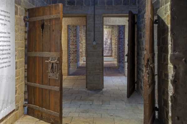Old wooden cell doors in Het Toreke museum, former 19th century prison at the Grote Markt in the