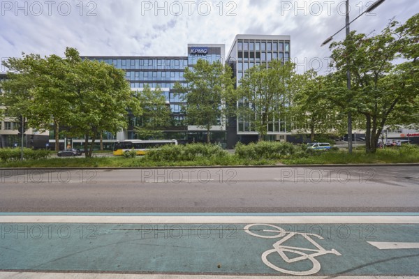 Auditing and management consultancy KPMG, modern architecture, street, public bus, cycle path,
