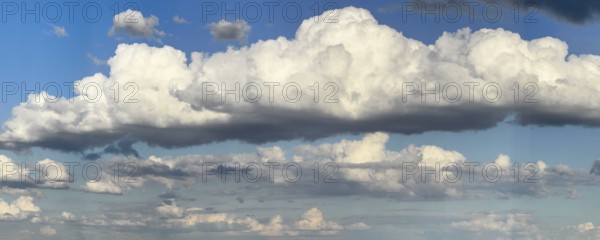 Stratocumulus cloud in the centre of the picture, dense cloud cover of many different cumulus