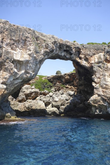 Natural rock arch at Cala Varques on the east coast of the Mediterranean island of Majorca between
