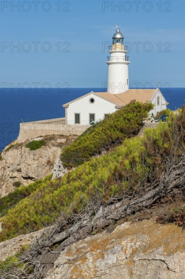 Lighthouse on Capdepera cliff on the east coast of the Mediterranean island of Majorca, blue sea in