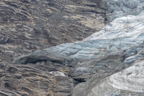 Majestic ice formations dominate the rocky terrain and show the beauty of a glacier in a secluded