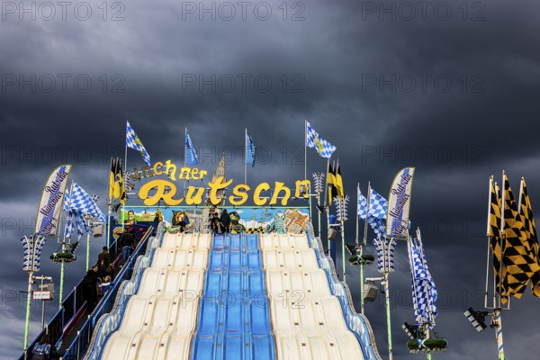 Dark clouds over the Oktoberfest attraction Münchner Rutschn, Festwiese, Theresienwiese,