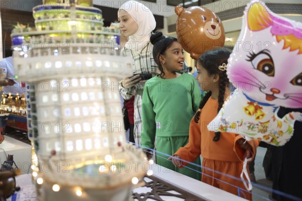 Syrian artisans display handmade artistic pieces to visitors at the Damascus International Fair.