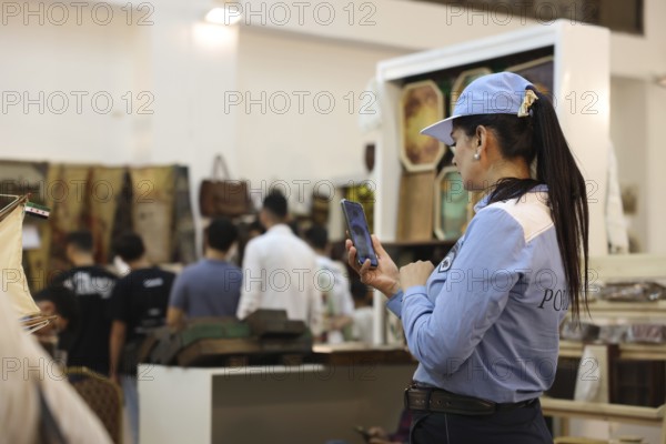 A female member of Syria's newly established tourist police stands inside the Damascus