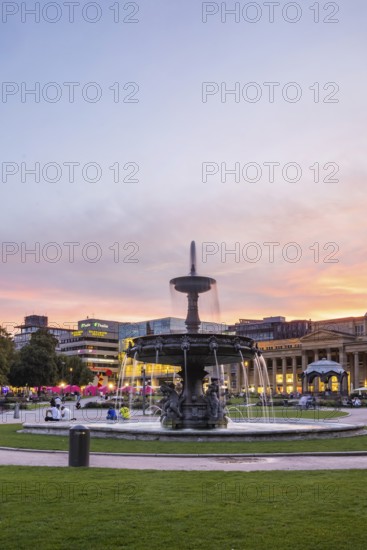 Evening atmosphere at Schlossplatz Stuttgart. View of Königstraße, art museum and Königsbau.