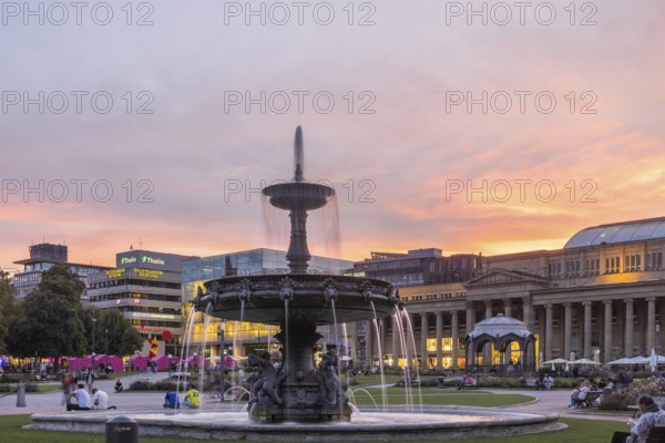 Evening atmosphere at Schlossplatz Stuttgart. View of Königstraße, art museum and Königsbau.