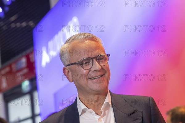 Philipp von Hirschheydt, CEO Aumovio. Exhibition stand of the company Aumovio. IAA MOBILITY in