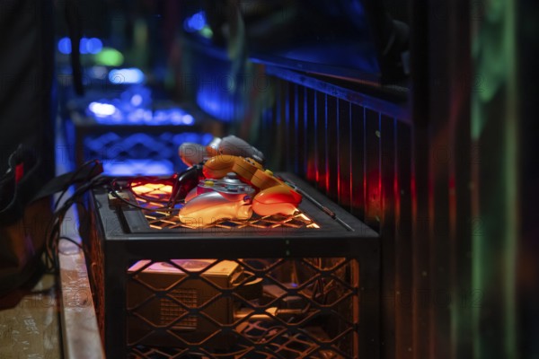 Orange-coloured gaming controllers, futuristic and tech-savvy atmosphere, arcade, Soho, London,