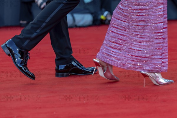 Venice, Italy - 2 September 2025: Tuxedo trousers, dinner jacket shoes and high heels during the