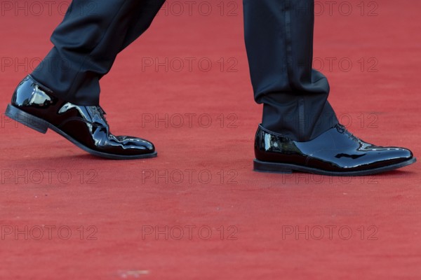Venice, Italy - 2 September 2025: Tuxedo trousers and dinner jacket shoes during the red carpet of