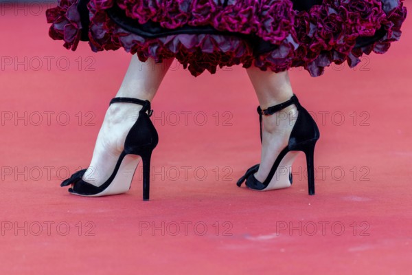 Venice, Italy - 1 September 2025: Close up of dress and high heels during the red carpet of - The