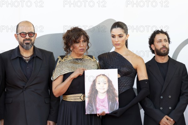 Venice, Italy - 3 September 2025: Kaouther Ben Hania and Saja Kilani with a portrait of