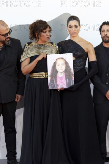 Venice, Italy - 3 September 2025: Kaouther Ben Hania and Saja Kilani with a portrait of