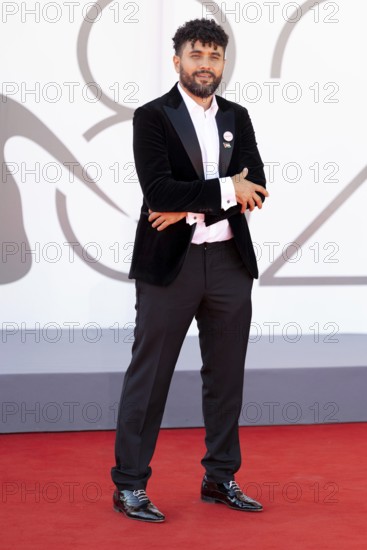 Venice, Italy - 3 September 2025: Amine Bouhafa wears a sticker in the colours of the Palestine