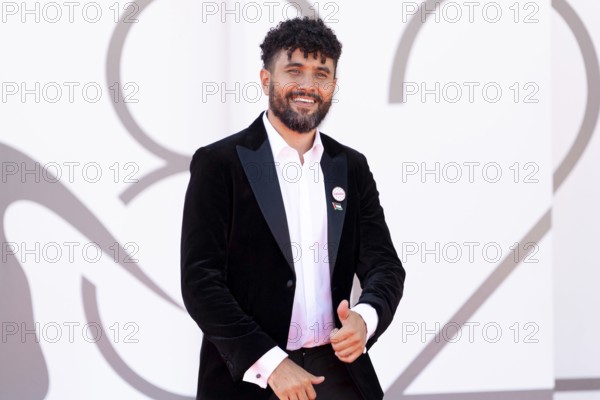 Venice, Italy - 3 September 2025: Amine Bouhafa wears a sticker in the colours of the Palestine