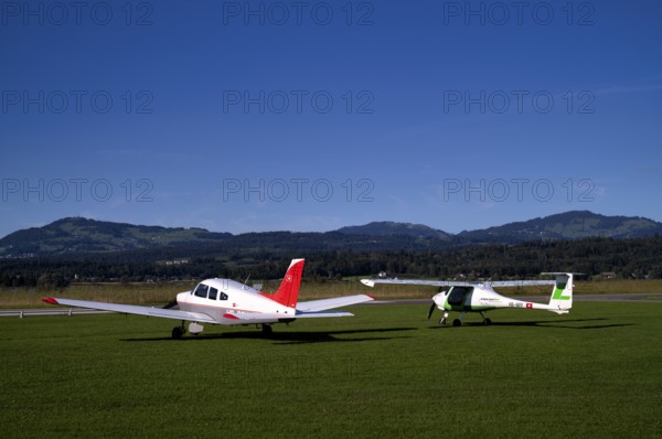 Pipistrel Velis Club on the right with aircraft registration HB-NPP stands next to Piper Archer II