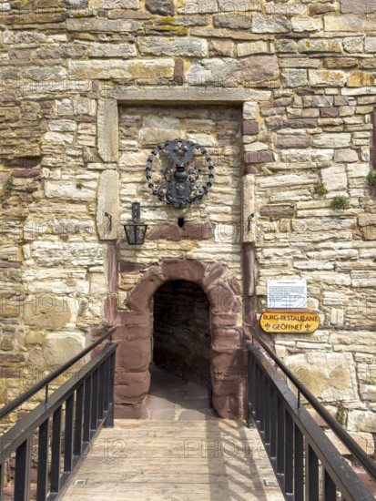 View over fortified bridge to historic small narrow castle gate Access to castle courtyard of 13th