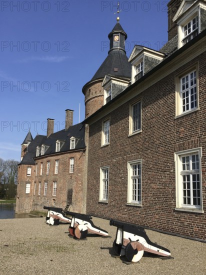 View of small cannons in front of right part of outer bailey building, left in background part of