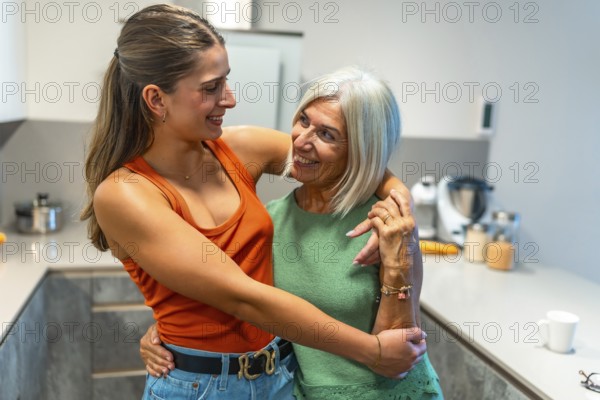 Senior mother and adult daughter hugging, sharing a tender moment of affection and familial bonding