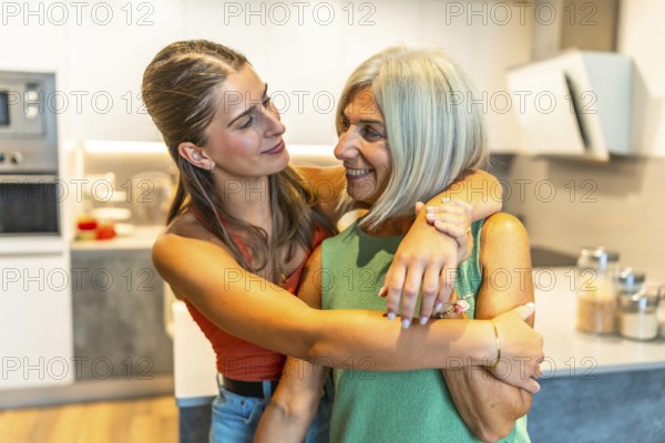Daughter embracing her elderly mother in a bright kitchen, radiating love and care in a warm,