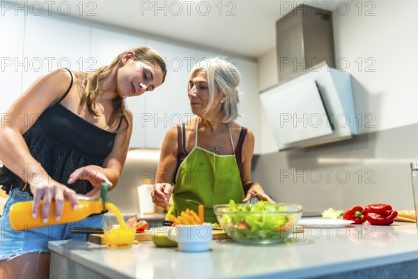 Two women preparing a healthy meal in a contemporary kitchen, focusing on fresh ingredients like
