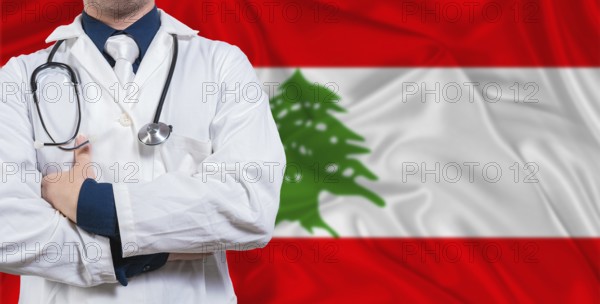Male doctor with stethoscope on Lebanese flag. Doctor holding stethoscope on Lebanon flag