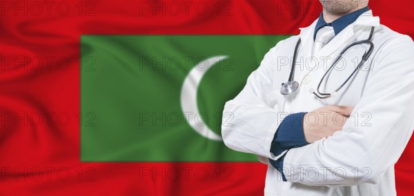 Maldives healthcare concept. Male doctor on Maldives flag. Doctor with crossed arms on Maldives