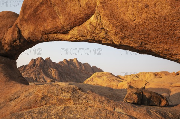 The Pondok mountains seen through The Bridge belong to the Spitzkoppe mountain compound.