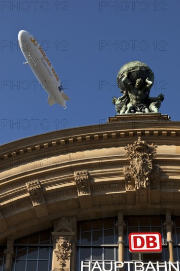 Main front of the main railway station with Atlas carrying the globe on his shoulders and a