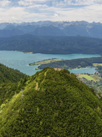 Sweeping views of lakes and mountains under a cloudy sky, Herzogstand summit, Walchensee,