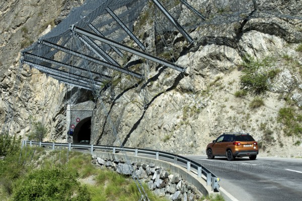 Safety nets on the rock face at the exit of the Petits Pontis tunnel protect road traffic on the